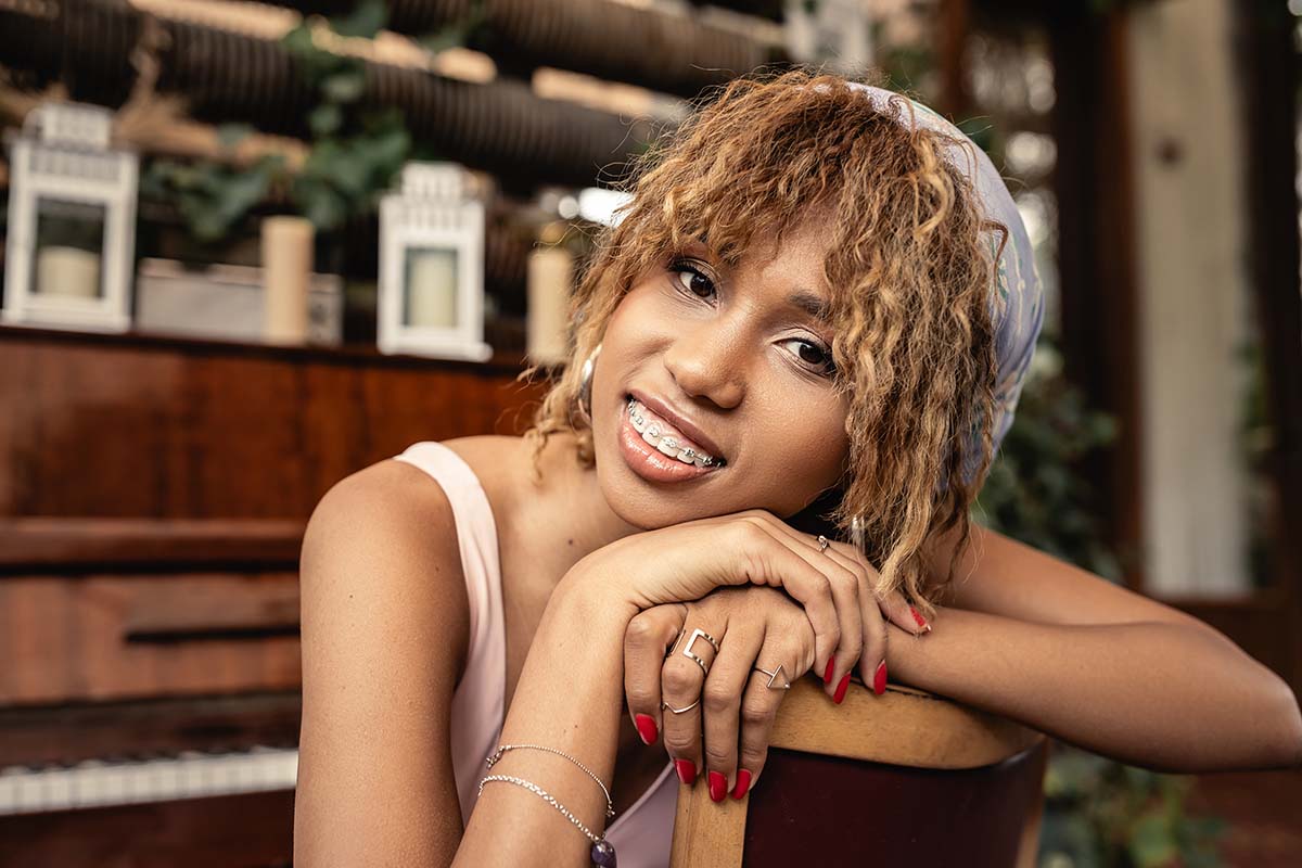 portrait-of-smiling-teen-girl-with-braces-at-the-piano-1024x683-1